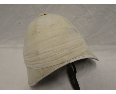 A good quality old copy Boer War-style white pith helmet