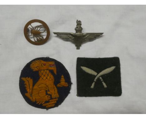An original Second War Chindit embroidered arm badge, Gurkha patch, Long Range Desert Group brass cap badge and a Parachute R