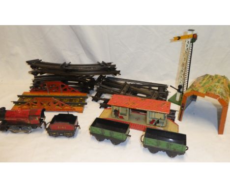 A selection of O gauge railway items including Hornby O gauge tin plate locomotive and tender, two various wagons, various tr