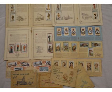 Various albums containing sets and part sets of cigarette cards including Players RAF badges; Players Uniforms of the Territo