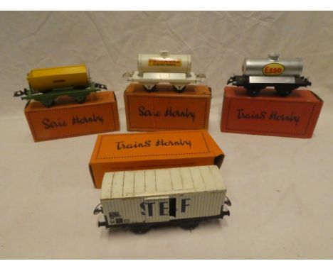 French Hornby O gauge - four boxed goods wagons including Esso tank wagon, NSCF tipper, Primagaz tank wagon, etc (4)