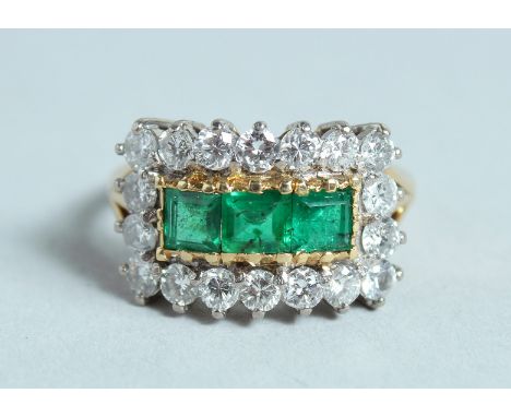 A GOOD DIAMOND AND EMERALD RING.