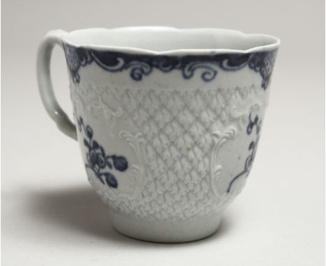 A Wm. REID RARE LIVERPOOL COFFEE CUP with a scale moulded body, moulded cartouches, painted with blue flowers.