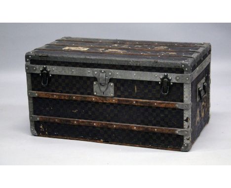 AN OLD LOUIS VUITTON WOODEN BANDED LEATHER BOUND TRUNK with two pull out compartments. 2ft 7ins long, 1ft 5ins wide &amp; 1ft