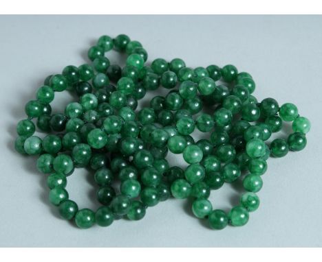 A STRING OF JADE BEADS.