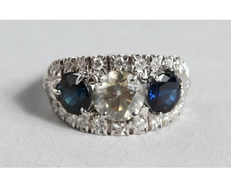 A SUPERB 18CT GOLD, SAPPHIRE AND DIAMOND THREE STONE RING.