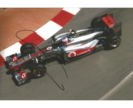 Motor Racing Jenson Button 12x8 signed colour photo pictured driving for McLaren Mercedes in 2011. Good Condition. All autogr
