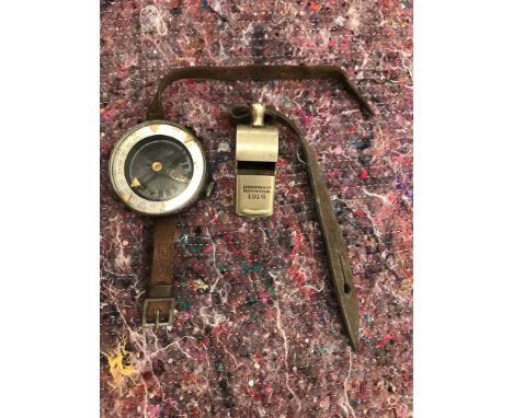A WWII Russian wrist compass; together with a 1916 whistle