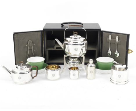 A fine Christopher Dresser design cased tea-set for two persons with sterling silver accessories, 1909, retailed by Kendall &