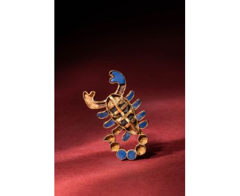 Late Period, Ca. 664 - 332 BC.An amazing 19.5 ct gold inlaid pendant rendered in a scorpion shape. The pendant is decorated o