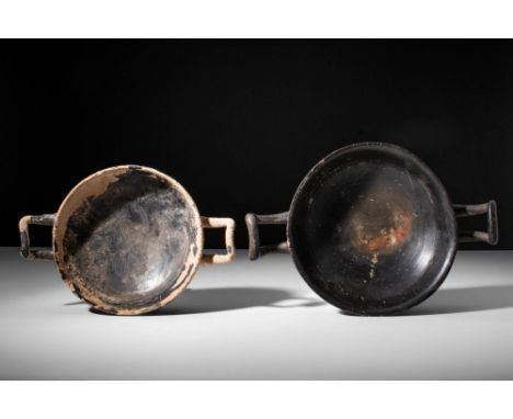 Ca. 500 - 300 BC.A beautiful pair of Greek pottery kylix with a low foot supporting a shallow bowl and two sloped handles. Th