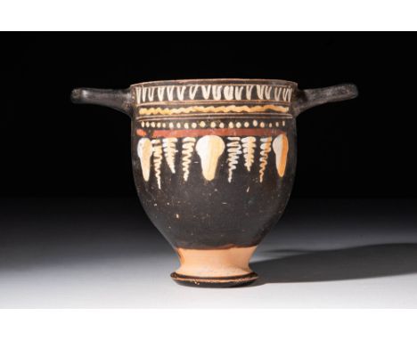 Ca. 350 BC.An Apulian black-glazed pottery skyphos with a cup-shaped form with two horizontal handles symmetrically affixed t