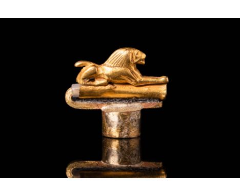 Second Intermediate Period, Ca. 1620 - 1550 BC.An Egyptian 20 ct gold bead of a recumbent lion with a tubular hole under the 