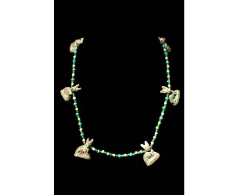 Ptolemaic to Roman Period, Ca. 100 BC - AD 100.A Romano-Egyptian necklace composed with glass and faience beads, accompanied 