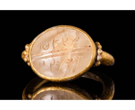 Ca. 200 BC - AD 200 BC.A Holy lands silver-gilt ring decorated with an engraved rock crystal intaglio with Aramaic script. Th