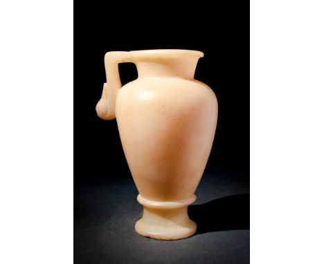Ca. 300 - 100 BC.A Hellenistic alabaster vessel with an inverted pear shaped body connected to a large neck and everted rim. 