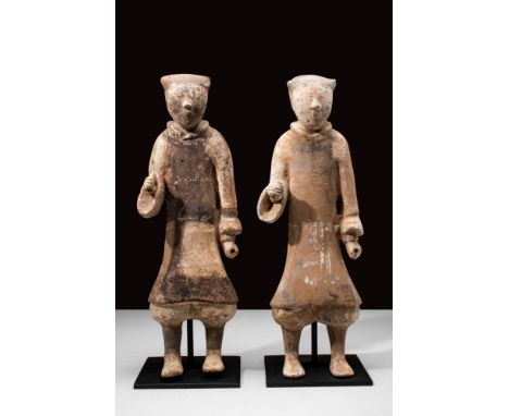 Han Dynasty, Ca. 202 BC - AD 220.A pair of Han Dynasty terracotta warriors. The warriors are dressed in long robes, loose tro