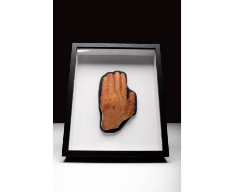 New Kingdom, Ca. 1550 - 1069 BC.A New Kingdom, high relief terracotta fragment depicting a right hand. The hand is portrayed 