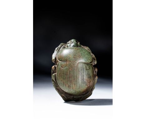 New Kingdom, Ca. 1550 - 1070 BC. A finely-detailed Egyptian green stone heart scarab with added anatomical details. The wings