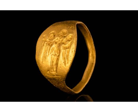 Ca. 300 - 100 BC.A stunning 23 ct Greek gold ring with an elliptical flat bezel depicting a standing Nike. The Nike has sprea