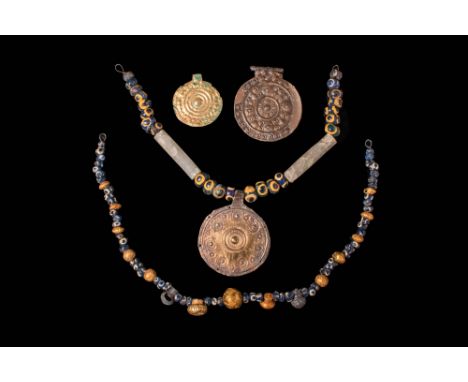 Ca. 800 - 700 BC.A collection of very fine Etrucsan jewellery, composed of multiple mosaic glass beads, two tubular rock crys