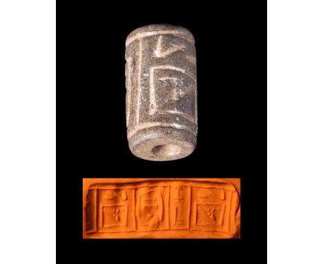 Early Dynastic Period to Old Kingdom, Ca. 2613 - 2494 BC.An Egyptian black stone cylinder seal engraved with signs. Cylindric