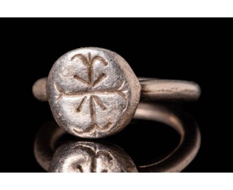 Ca. AD 600 - 800.An Early Medieval Byzantine silver ring with a round hoop. The bezel is adorned depicting a double cross. Th