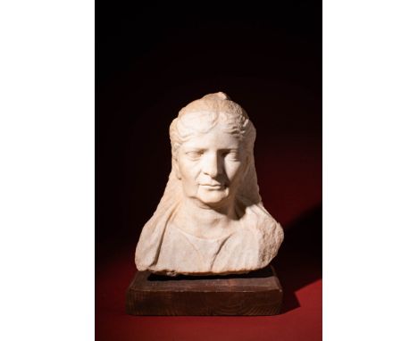 Ca. AD 100 - 200 .A marble bust of a Matrona depicting a mature woman in dignified repose. Her serene countenance conveys wis