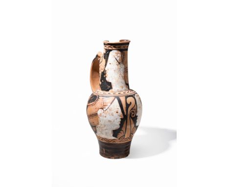 Torcop Group, Ca. End of 4th century BC.An inverted pear-shaped pottery oinochoe with a tapered foot supporting its graceful 
