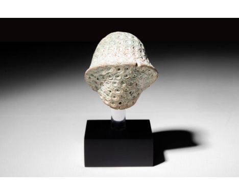 New Kingdom, Ca. 1550 - 1188 BC.An Egyptian pale green faience "blue" crown from a statue of a pharaoh. The shape is rounded 