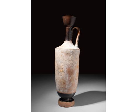 Ca. 460 - 420 BC.An Attic white ground lekythos with a long piriform body with a narrow neck connected to a conical rim with 