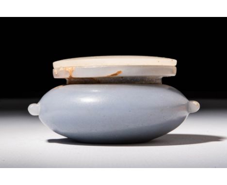 First Intermediate Period to Middle Kingdom, Ca. 2133 - 1797 BC.An Egyptian anhydrite kohl vessel with alabaster cover. The b