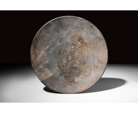 Early Dynastic Period, Ca. 3100 - 2700 BC.An Egyptian greywacke bowl with shallow form and an inverted rim. For similar see: 