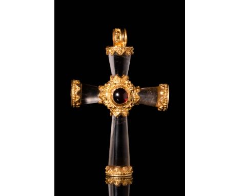 Ca. AD 500 - 700. An extraordinary cross-shaped pendant made of rock crystal in a conical shape, with the widest part facing 