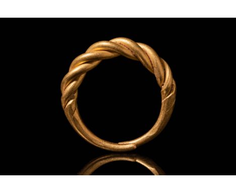 Ca. AD 800 - 1000.A stunning Viking Gold twisted finger-ring formed from two gold rods of circular section and tapering towar