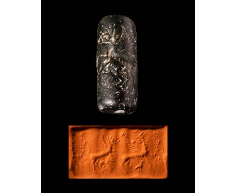 Ca. 1100 - 800 BC.A Sumerian hardstone cylinder seal depicting two quadrupeds. The first is depicted turning back with horns 