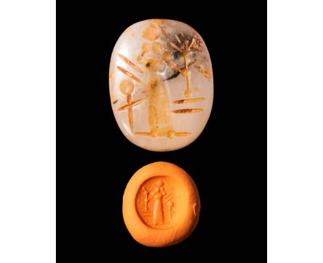 Ca. 600 - 500 BC.A Neo - Babylonian stamp seal depicting a standing god facing left, with the tree of life and highly stylise