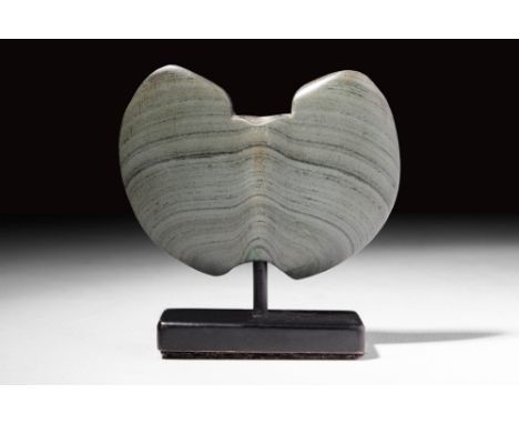 Ca. 3500 - 2500 BC.An amazing double axe with a vertical hole drilled. The stone is a beautiful deep green with butter-colour