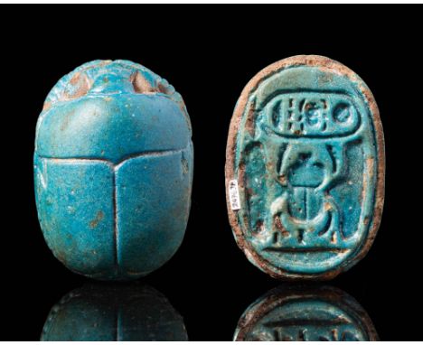 Kew Kingdom, Ca. 1342 - 1324 BC.A stunning scarab made in turquoise faience. The top displays characteristic insectile featur
