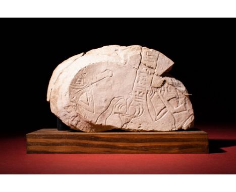 Late Period, Ca. 664 - 332 BC.An Egyptian sunk relief showing two figures. There is a bearer on the left the where the figure