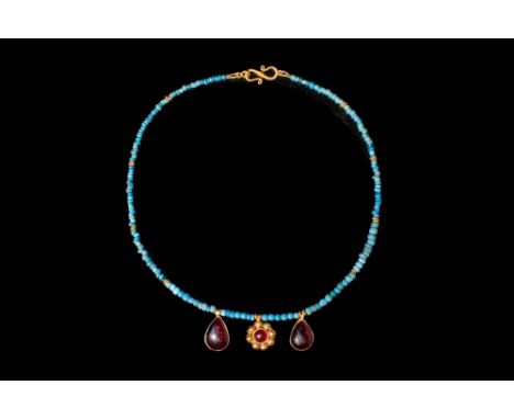 Ca. 1200 - 800 BC.A Western Asiatic turquoise necklace composed with cylindrical turquoise beads interspersed with gold beads