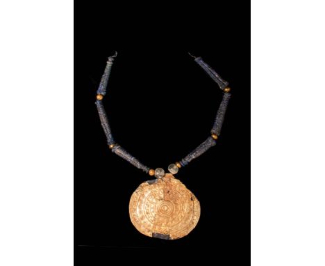 Ca. 800 - 700 BC.An extremely fine Etruscan necklace composed of tubular glass and round gold beads. Attached to this is a la