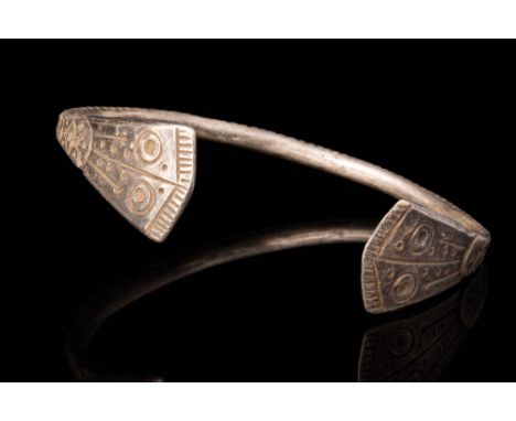 Ca. 500 - 400 BC.A Celtic silver bracelet decorated with stylised snake heads finials. For similar see: I Celti, Bompiani, 19