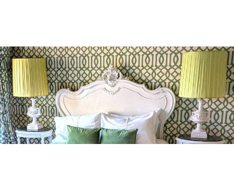 A pair of white painted metal table lamps, each of urn shape, 99cm high, together with a 1970s style green glazed table lamp 