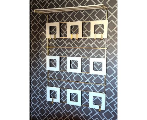 A 1970s style German white painted set of coat hooks, of geometric design78w x 117h cm