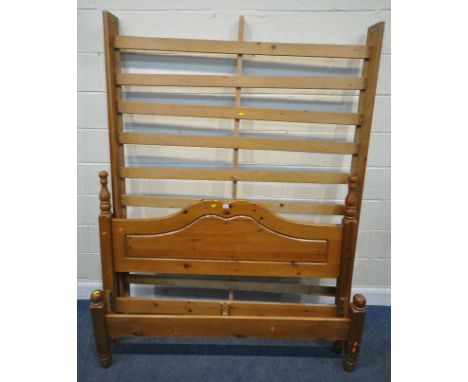 A MODERN PINE 4FT6 BEDSTEAD, with side rails, slats, and a central support bar, condition report: marks, scuffs, other signs 