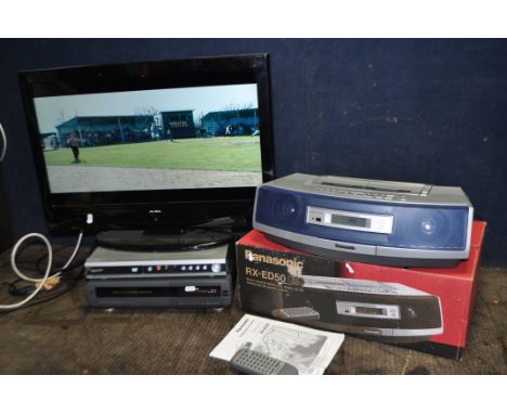 AN ALBA 26in TV, a Sanyo DVD player, a Hitachi VHS recorder and a boxed Panasonic portable hi fi with remote (all PAT pass an