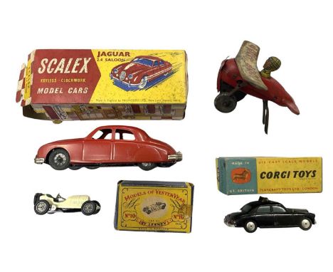 A mixed lot of various die-cast and tinplate toys, to include:  - Boxed Scalex clockwork car - Tinplate Aeroplane - Boxed Cor