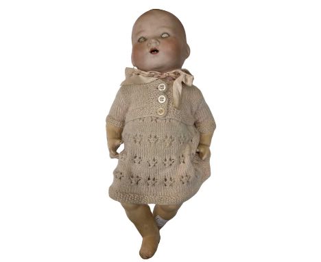 An Armand Marseille bisque head baby doll. Marked to rear of head: AM - Germany - 351./.3 1/2. KLength approximately: 36cm
