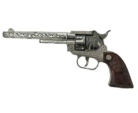 A vintage 'Rustler Bronco' toy revolver by Crescent Toys